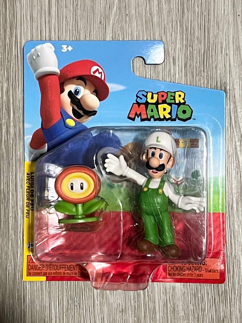 Nintendo Super Mario Luigi Figure with Fire Flower Accessory